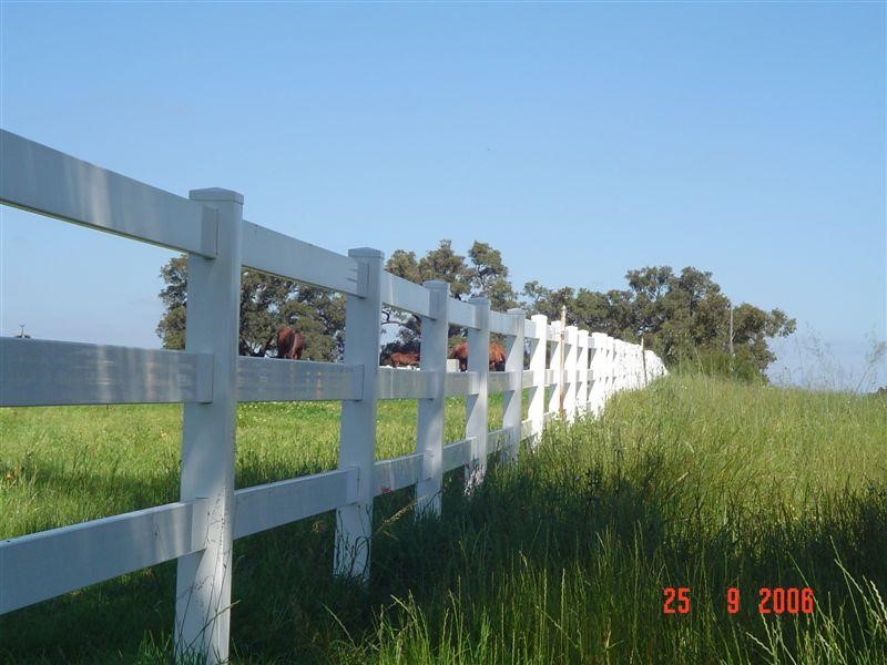 A horse stable white fence.